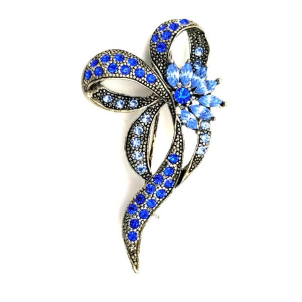 Silvertone Vintage bow pin with light and royal blue rhinestones